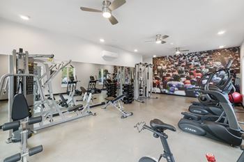 A spacious home gym with a variety of exercise equipment